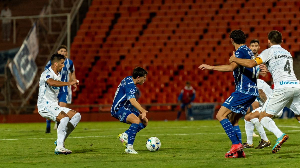 Football players competing on the pitch